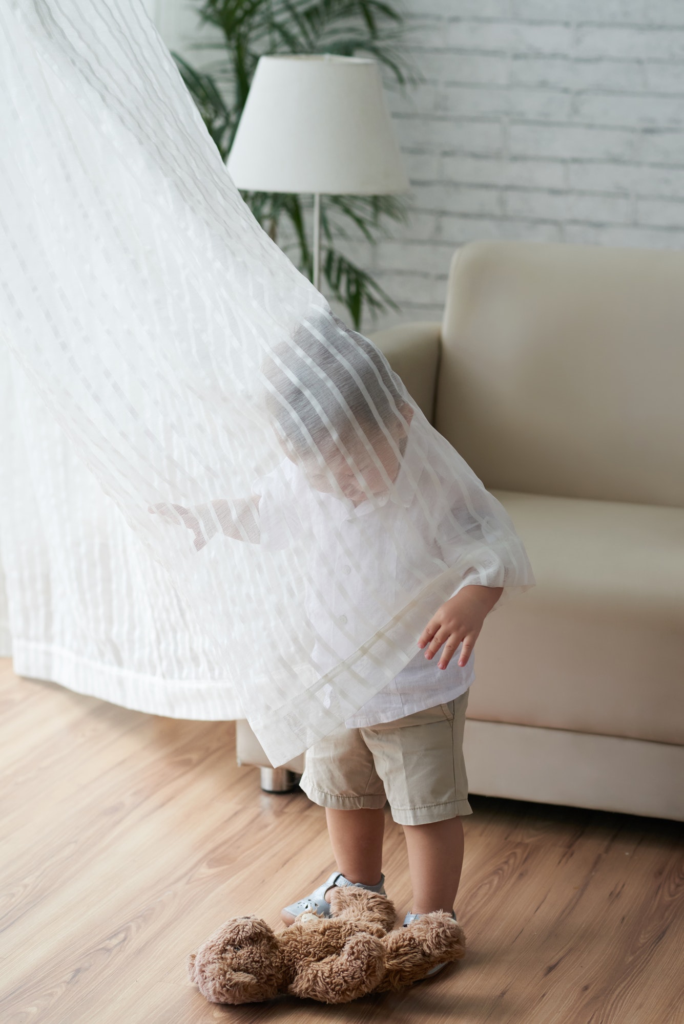 Kid in curtain